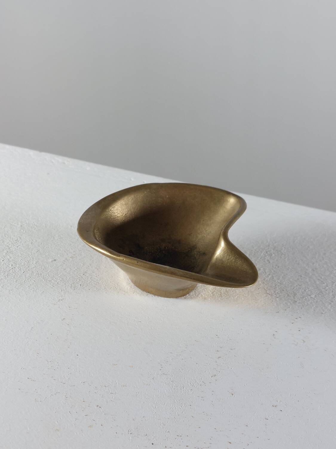 Vintage brass ashtray with an organic design from the 1950s.