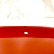 Vintage round wall mirror in orange plastic - diameter: 46 cm
