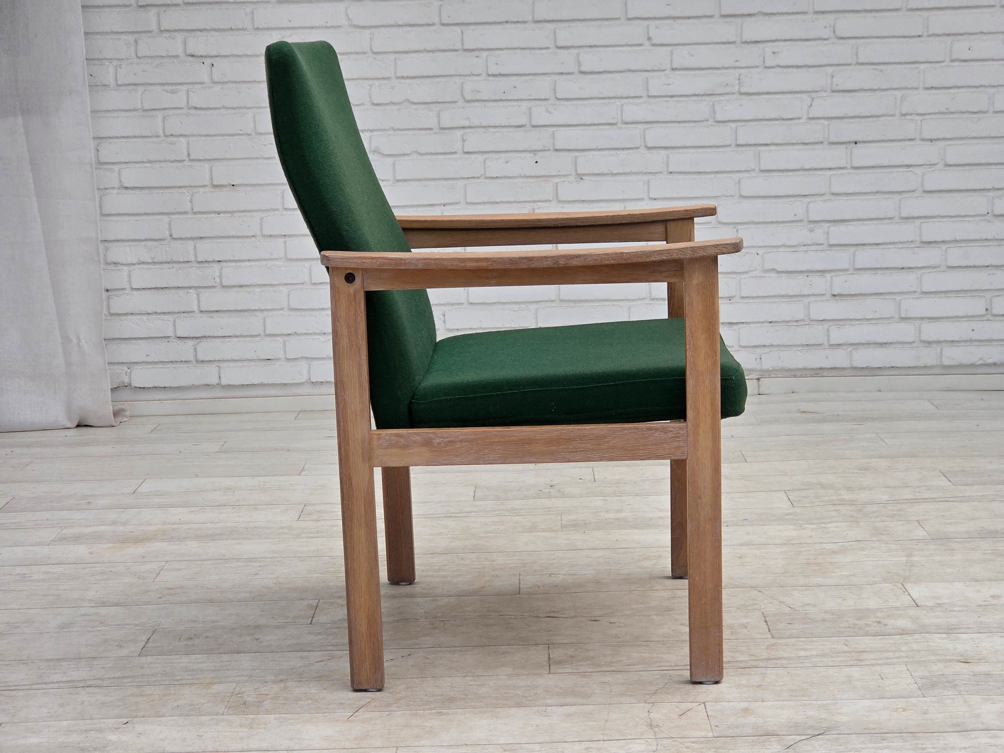 1980s, Danish armchair by Høng Stole, green furniture wool, oak wood.