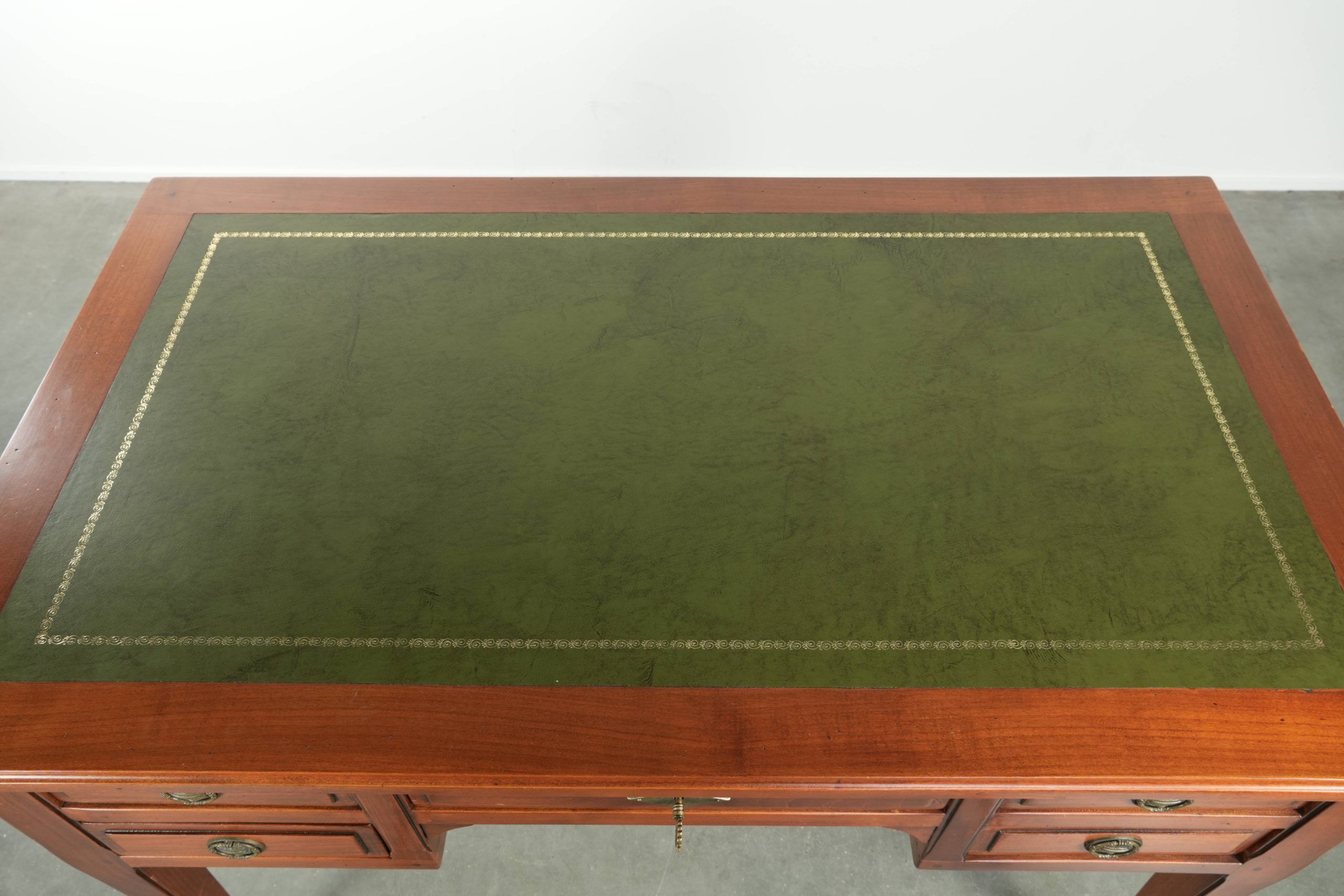 Elegant English style desk with green leather top, gold details and drawers