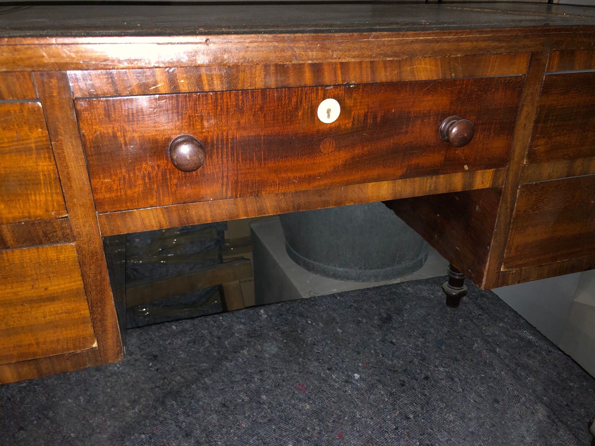 Antique mahogany desk with leather top