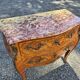 Louis XV style jump commode with marquetry and marble decoration.