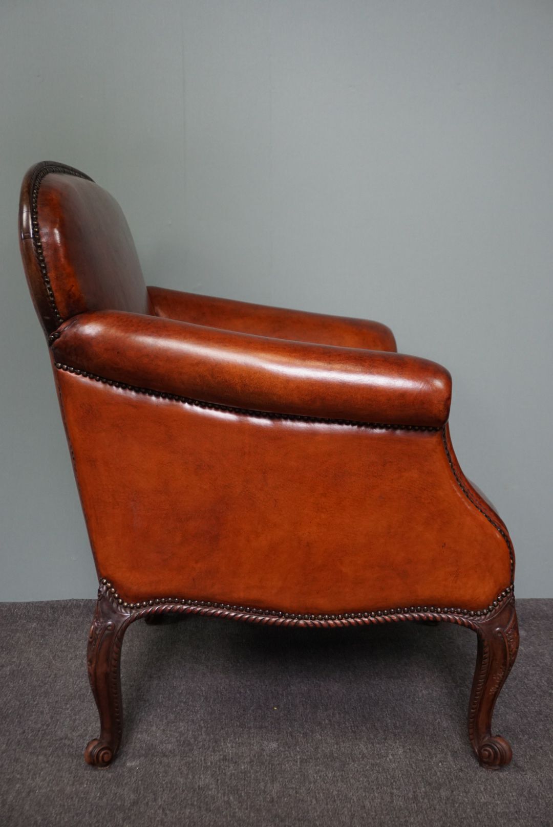 Old armchair in sheep leather