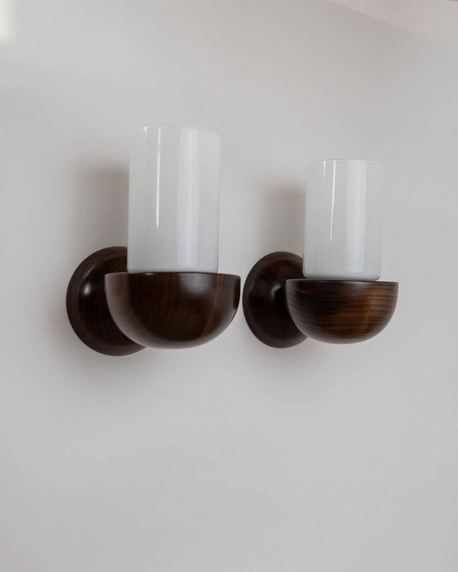 Vintage wall sconces from the 1960s, set of 2, dark wood with white glass shades, Mid-Century Modern lighting, sculptural wall sconces.