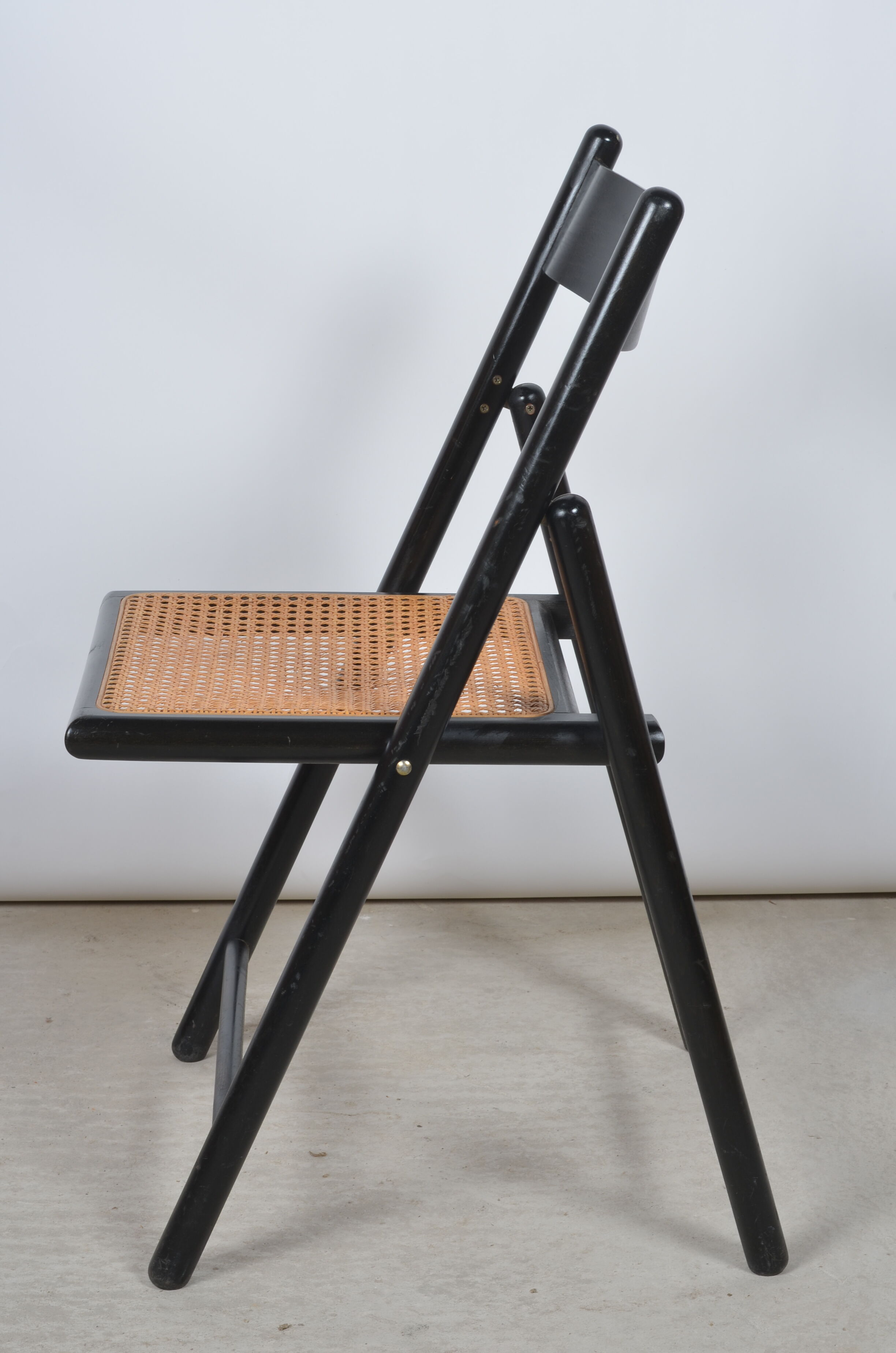 Folding chair seated in cannage