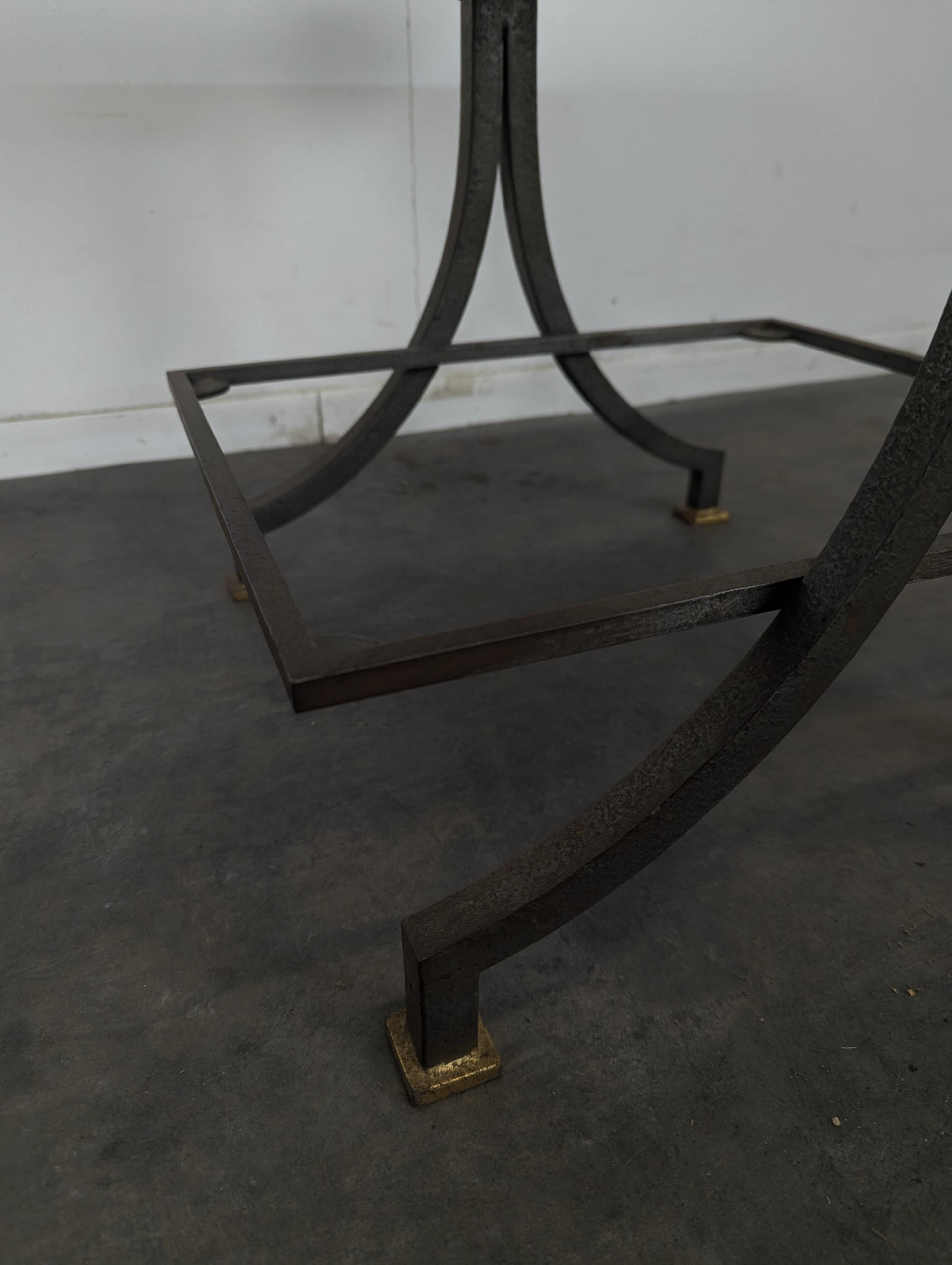 Neoclassical side table in wrought iron and eglomisé glass.