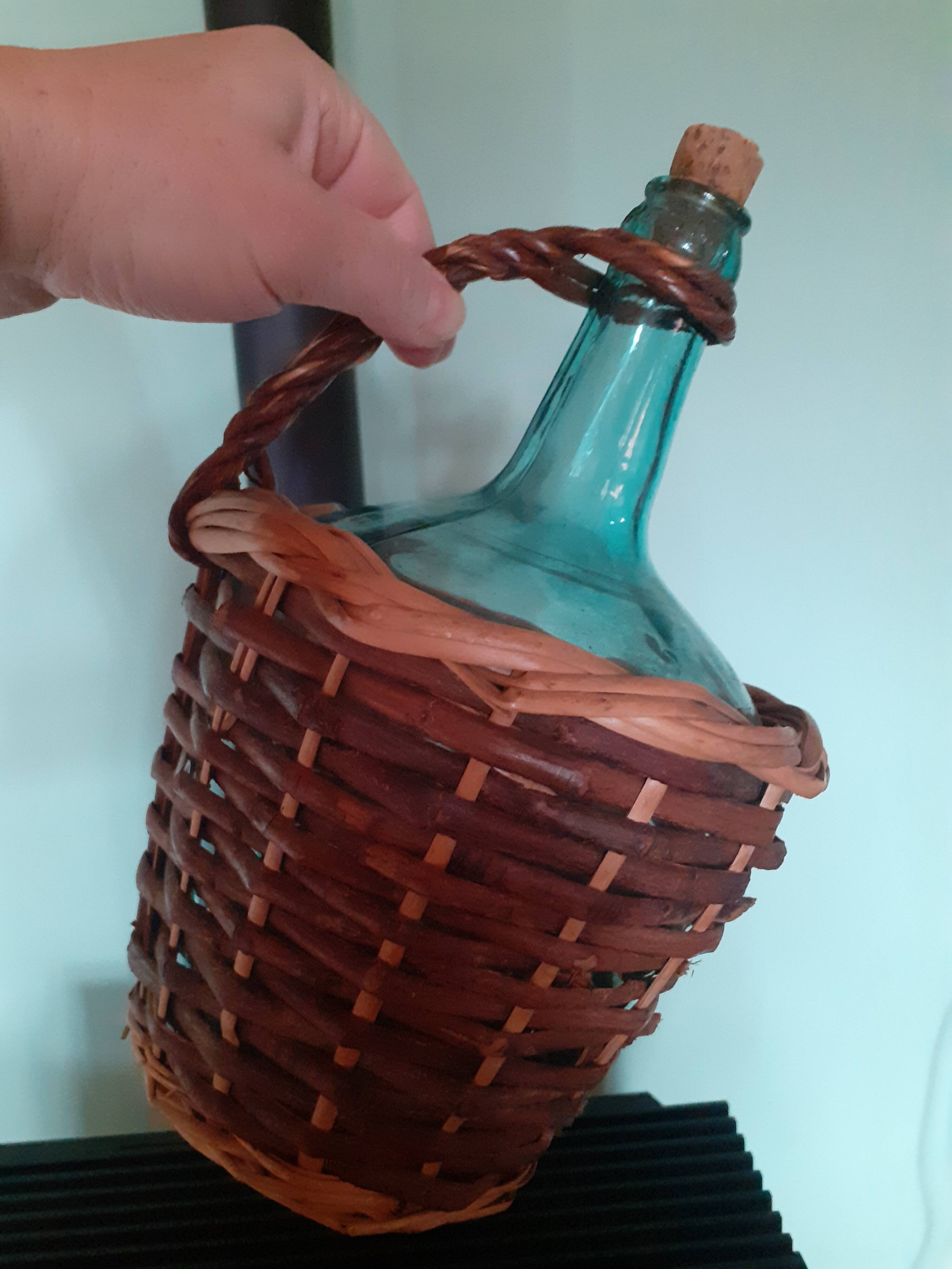 Glass bottle in its wicker dress