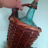 Glass bottle in its wicker dress