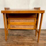 Modernist vintage chest of drawers in light chene has 3 drawers rattan top changing table