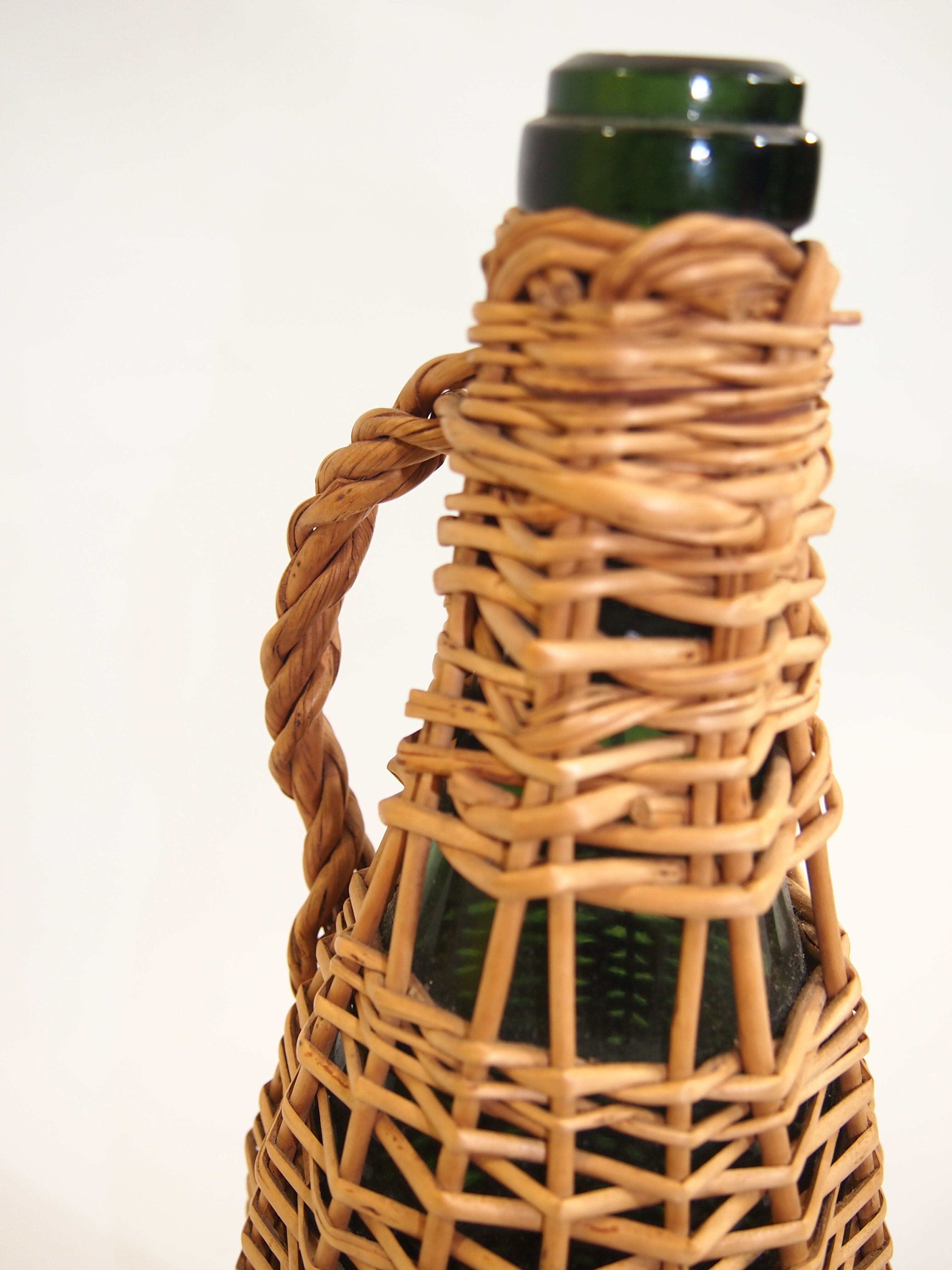 Bottle dressed in rattan