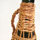 Bottle dressed in rattan