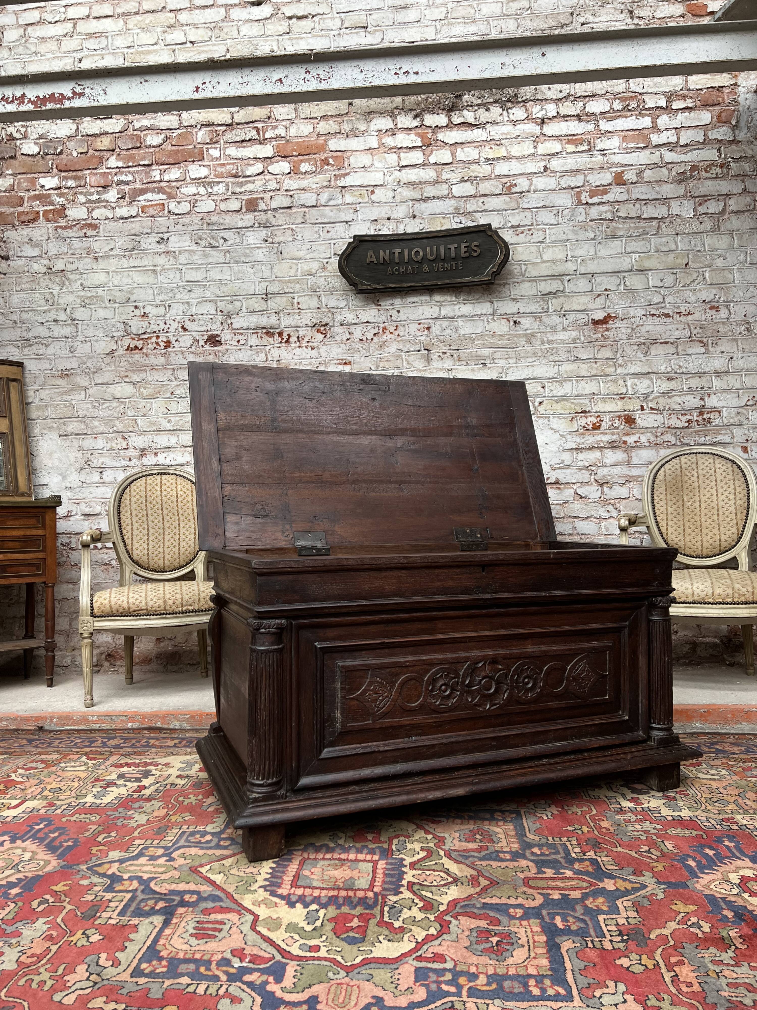 Chest in carved natural wood of the eighteenth century