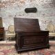 Chest in carved natural wood of the eighteenth century