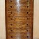 Pair of tall walnut chests of drawers with curved fronts in country style.