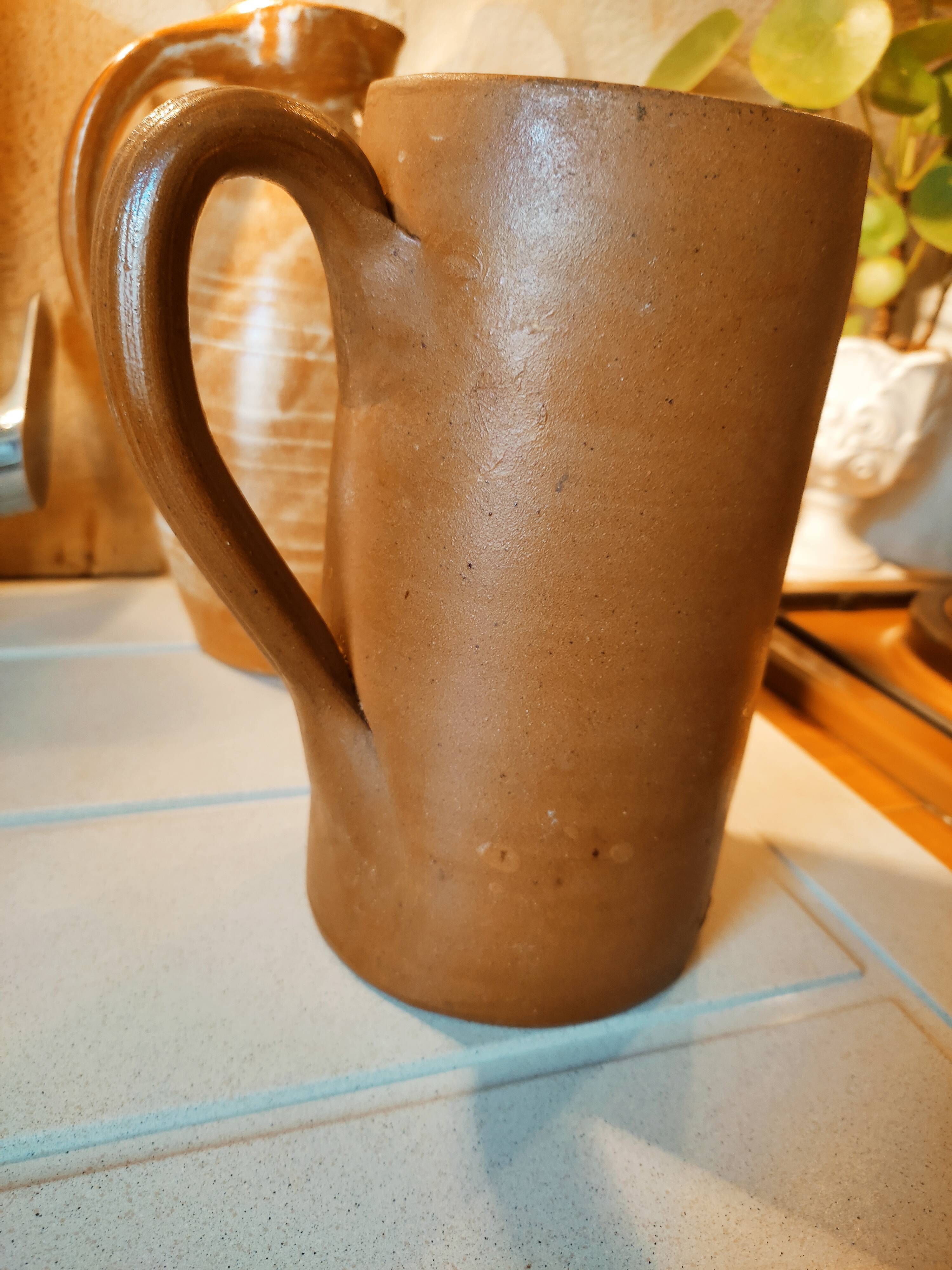 Duo of pitchers water, wine