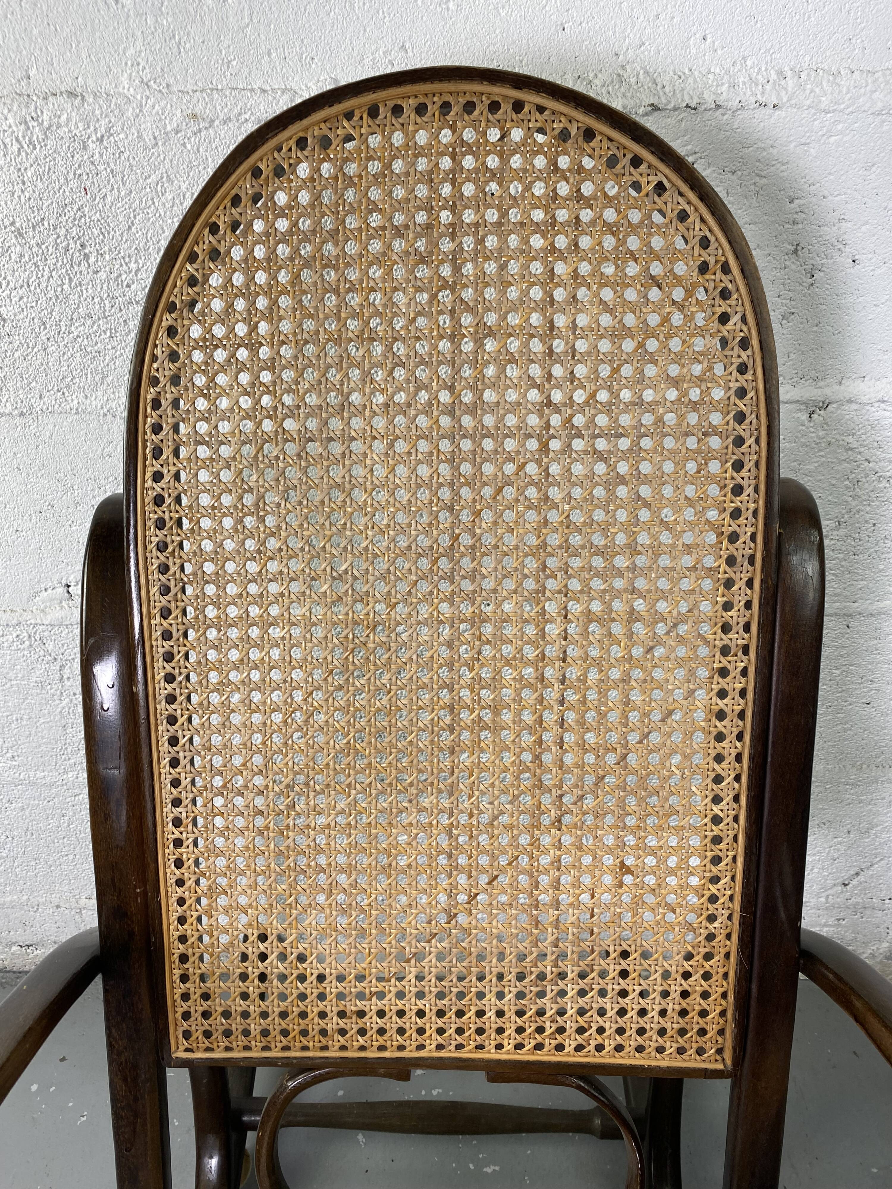 Rocking chair Chair in wood and Cannage from the 70s