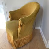 Velvet armchair with fringes