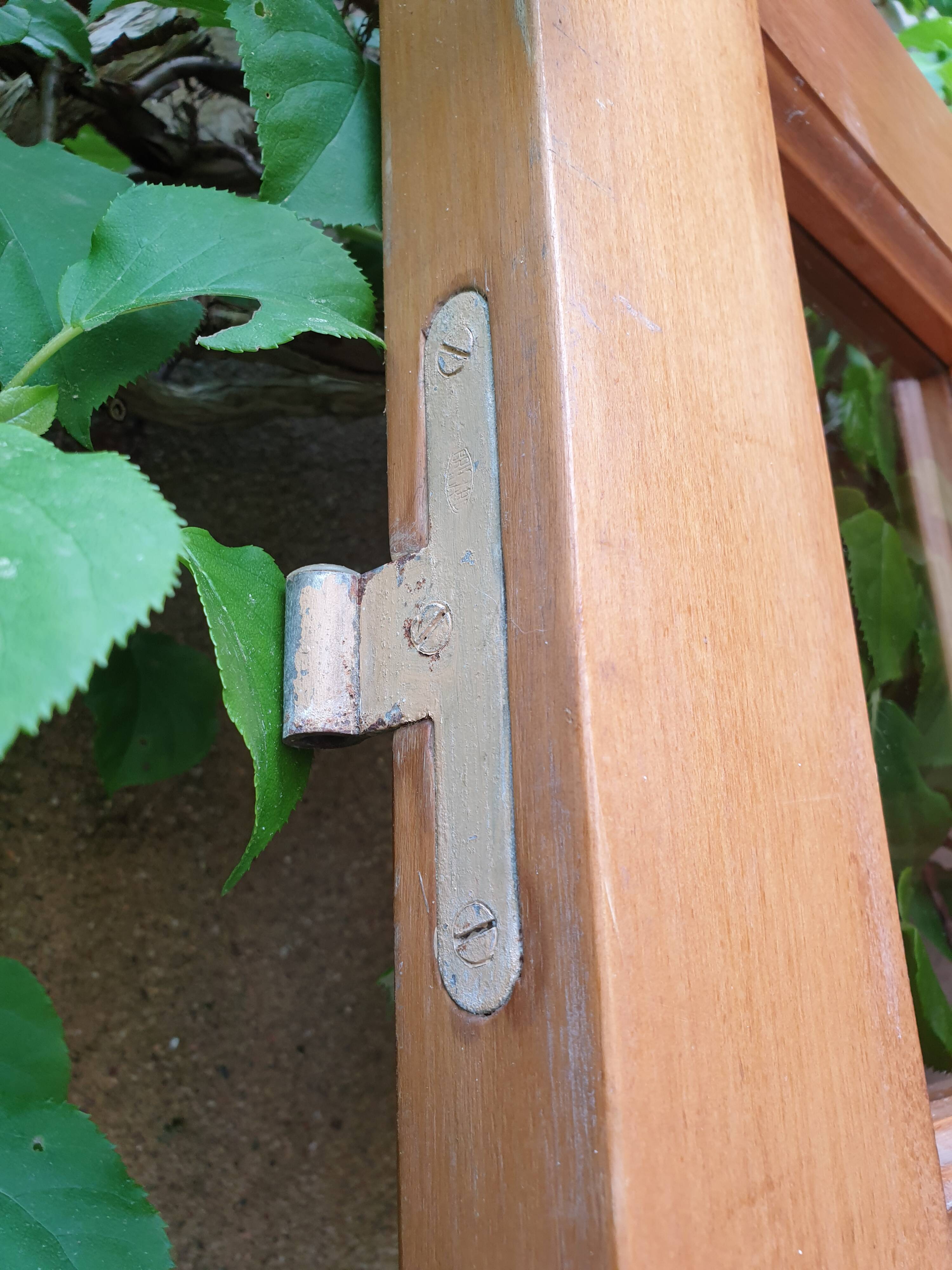 Old wooden door glazed with small tiles