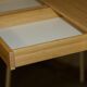 Small bamboo desk with three drawers.