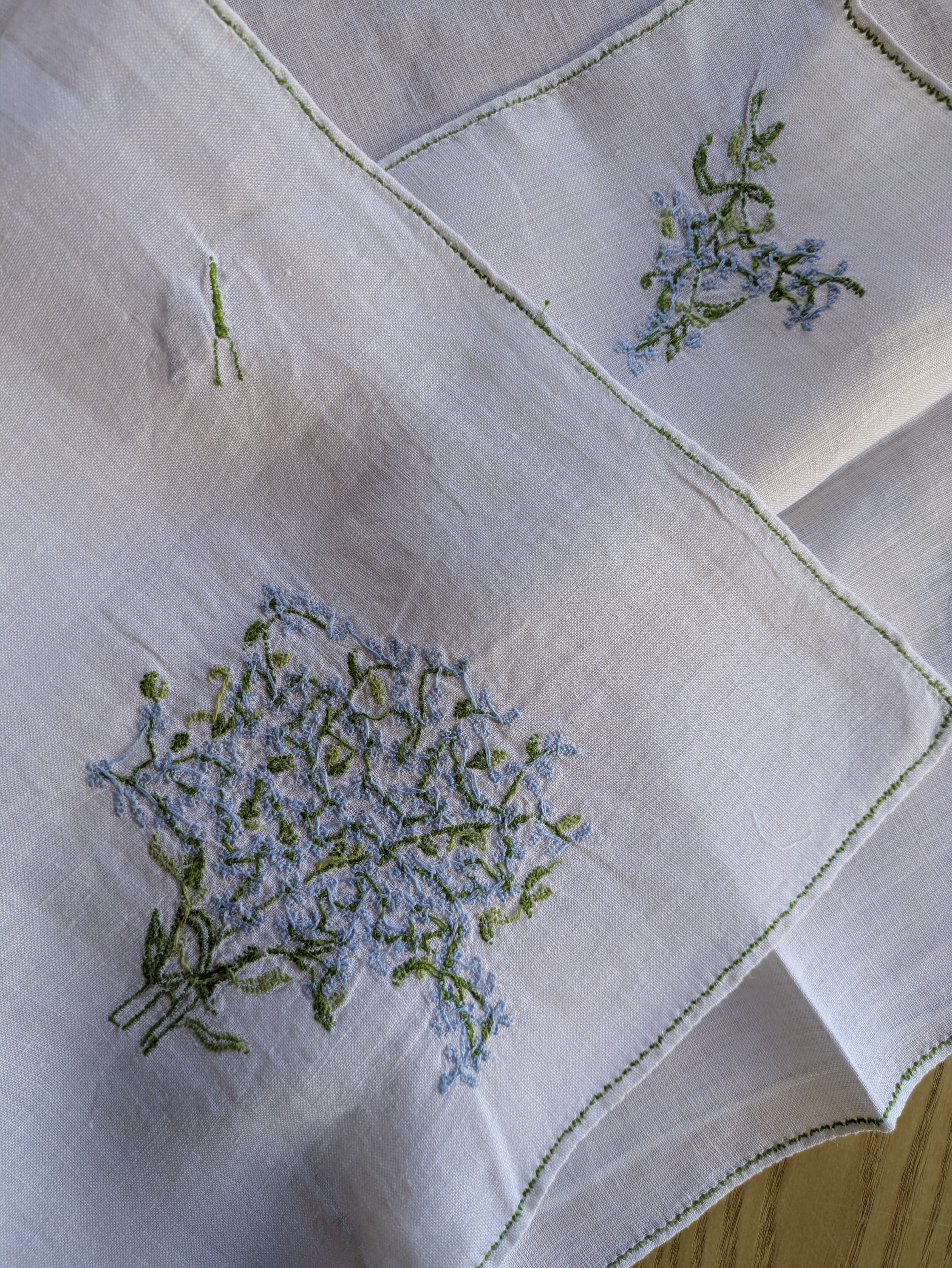 Hand-embroidered table duo in linen voile – Azure Bouquet & Butterfly