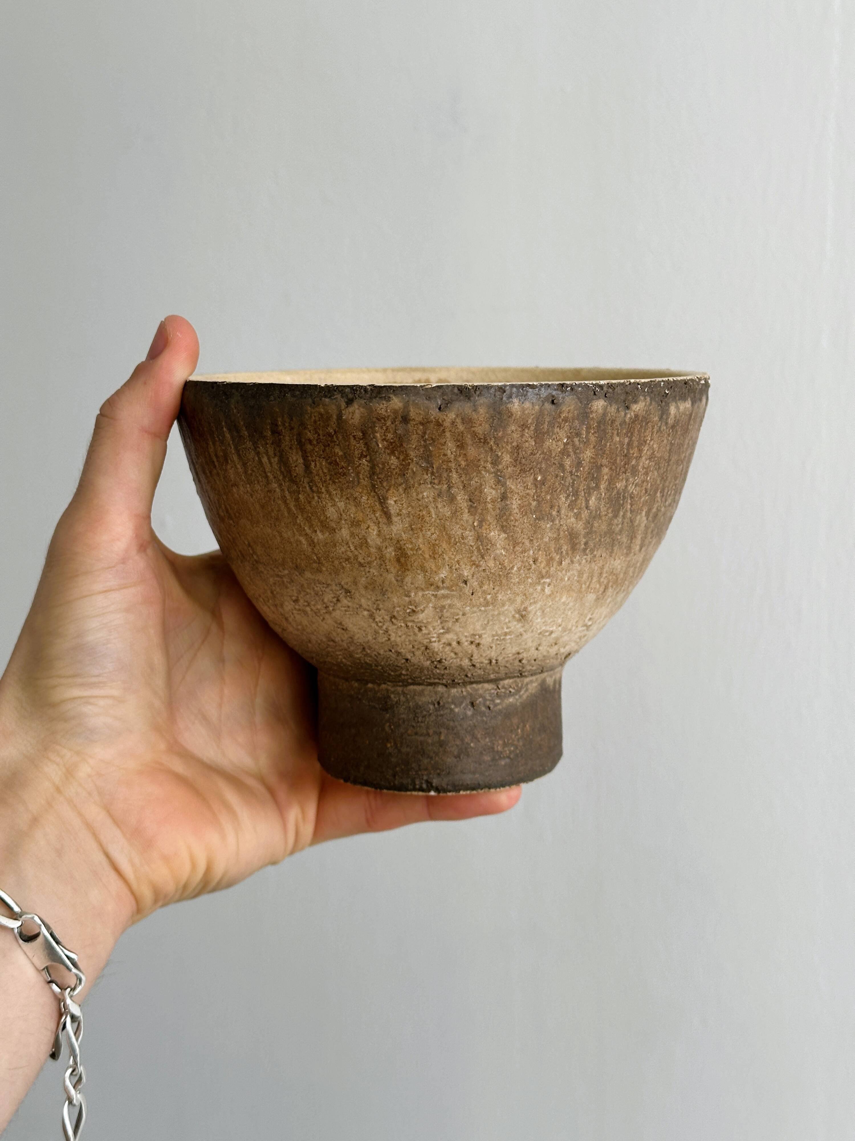 Small vintage cup in rustic glazed stoneware