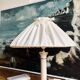 Vintage ivory ceramic lamp with gilding.