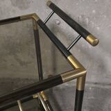 Black metal and brass rolling dessert trolley, smoked glass, 1970s.