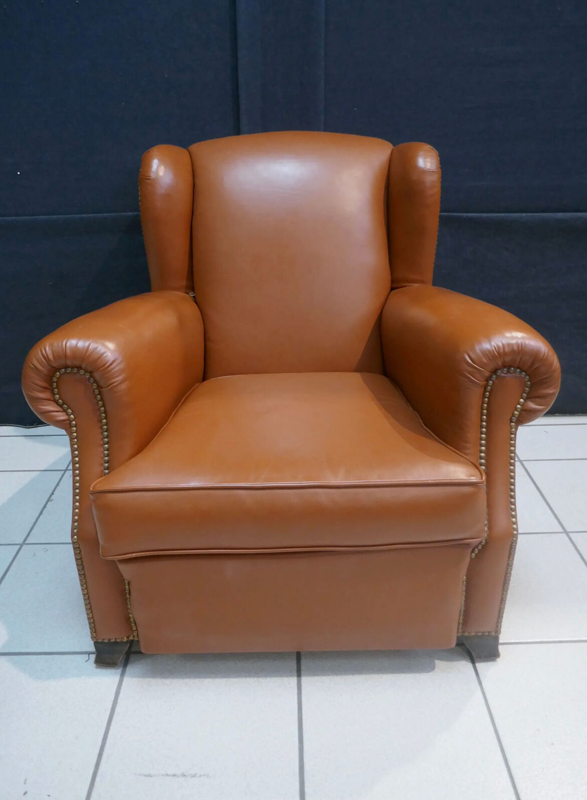 Club armchair with ears of the 40s/ 50s in restored leather