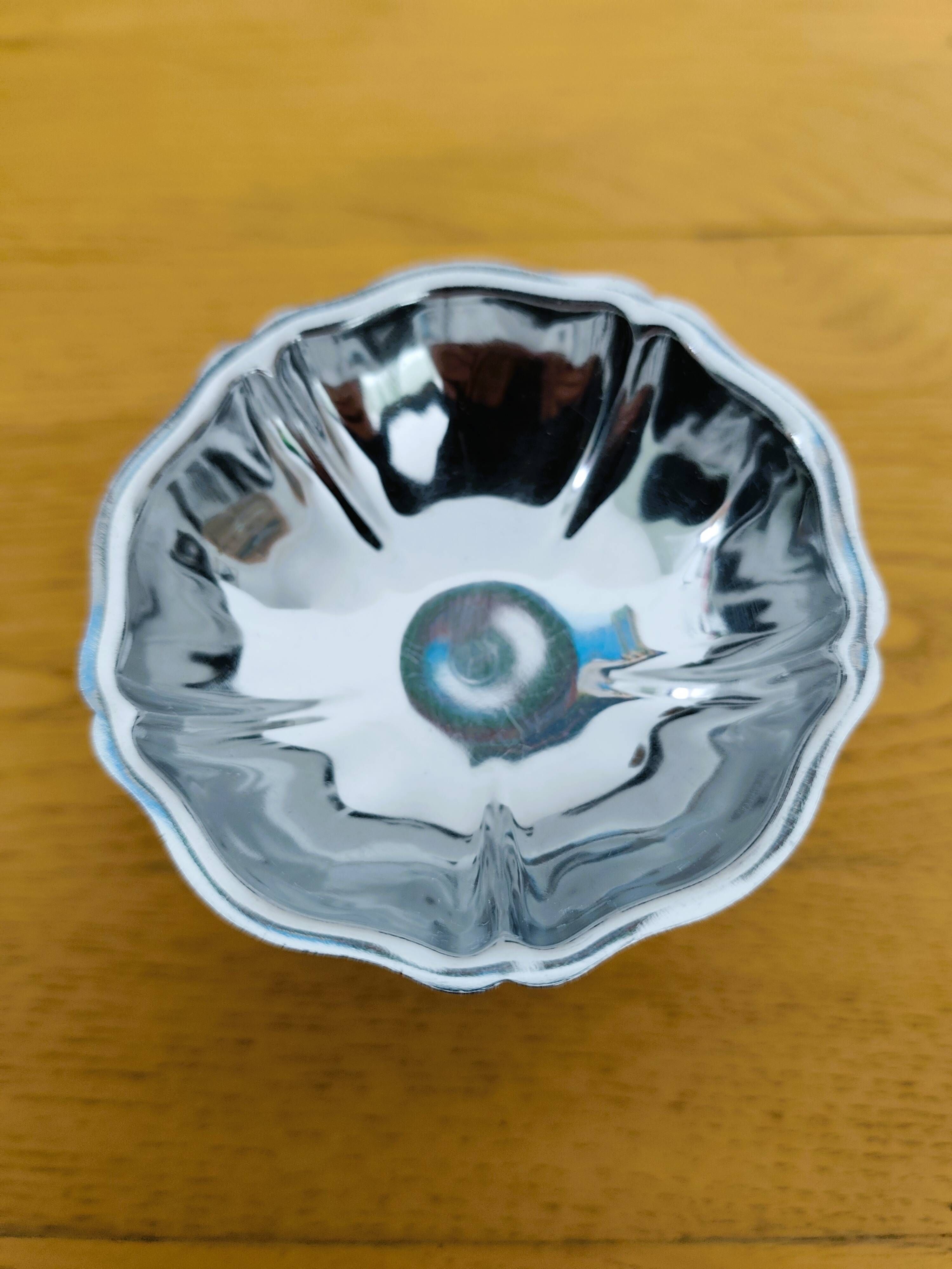 Set of 12 stainless steel bowls from the 1970s.