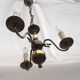 Metal chandelier repainted in copper color with 3 candle-shaped bulbs