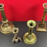 Set of 4 disparate brass candlesticks