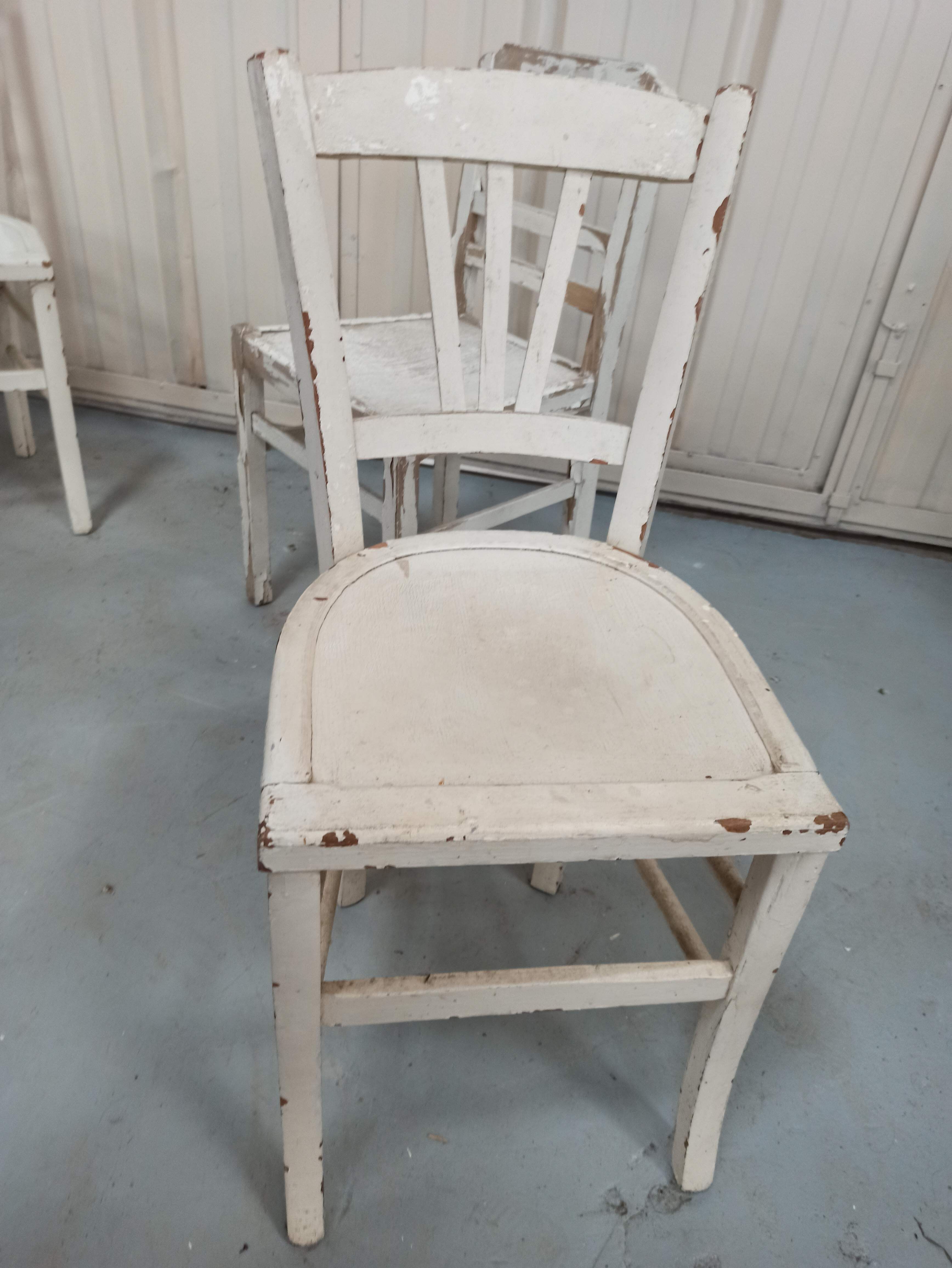 4 patinated white bistro chairs