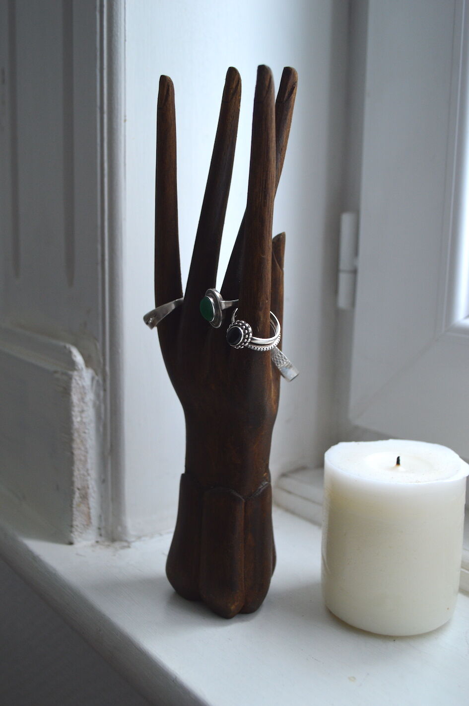 Carved wooden baguier hand