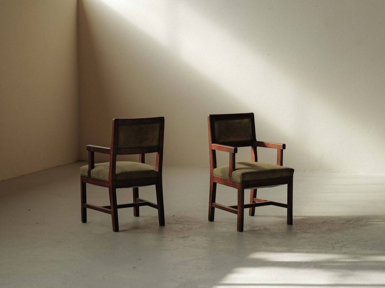 Pair of modernist armchairs in solid oak, France, circa 1940.