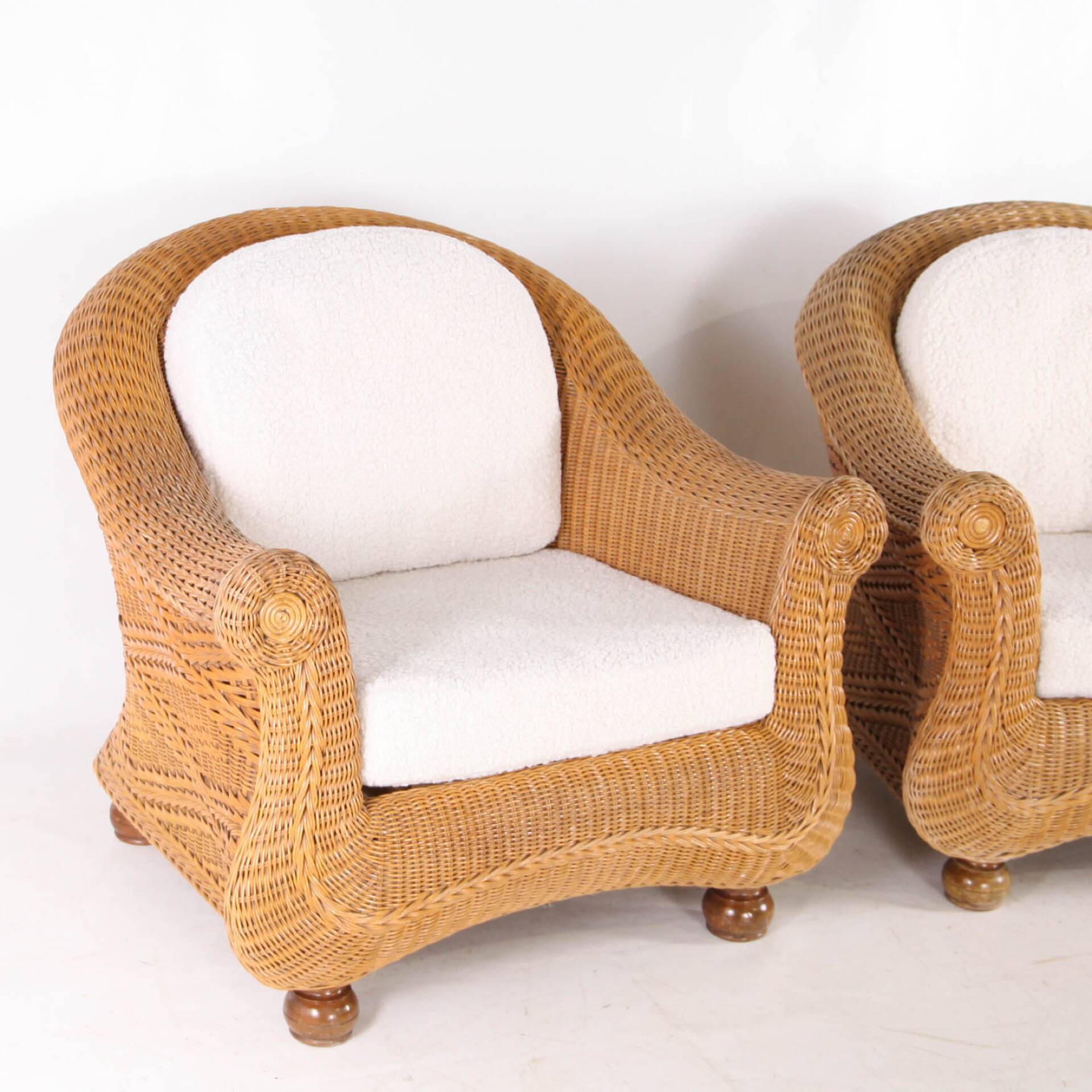 Pair of woven wicker armchairs