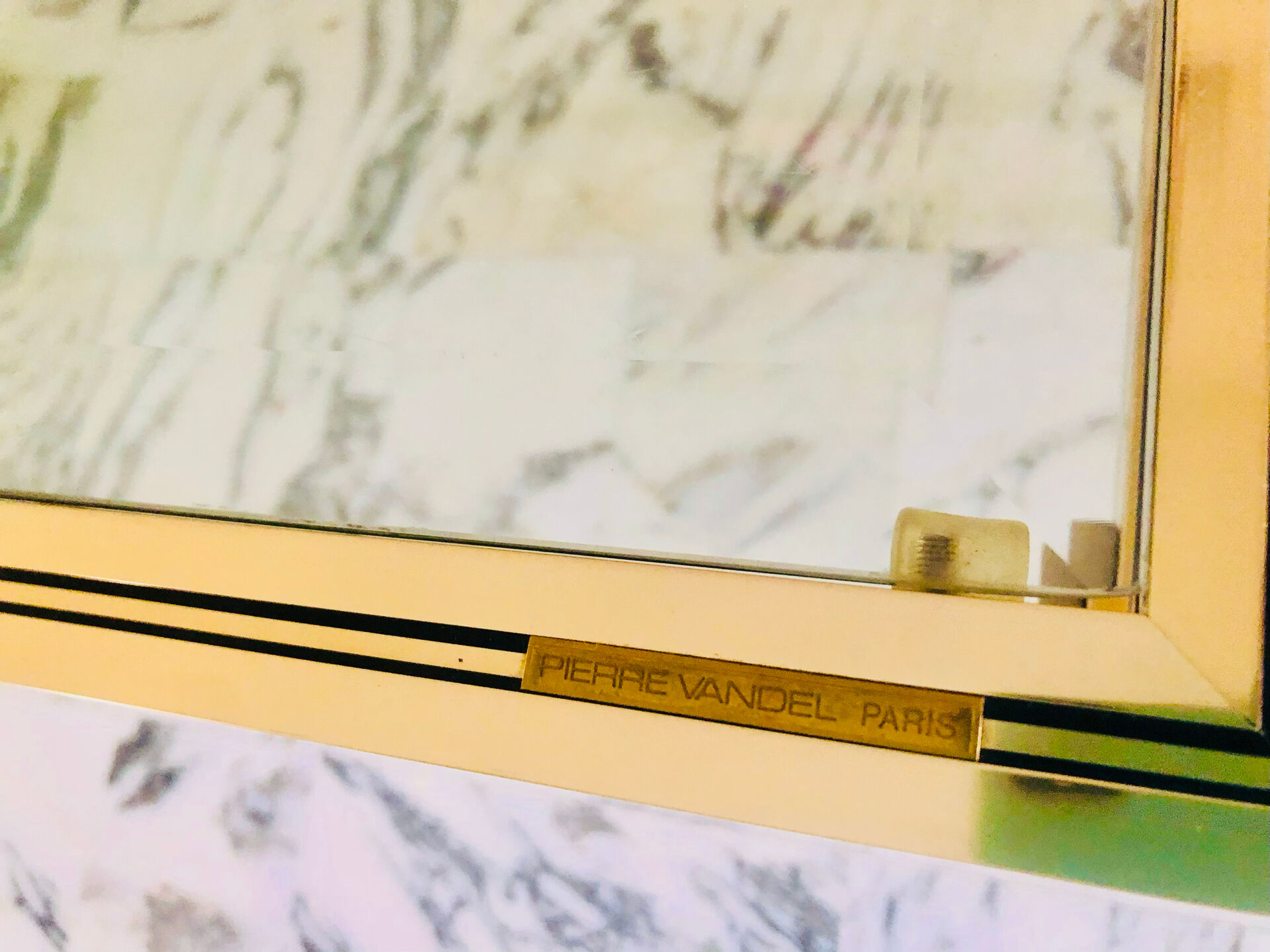 Coffee table with 2 brass and glass tops signed Pierre Vandel Paris, circa 70s.