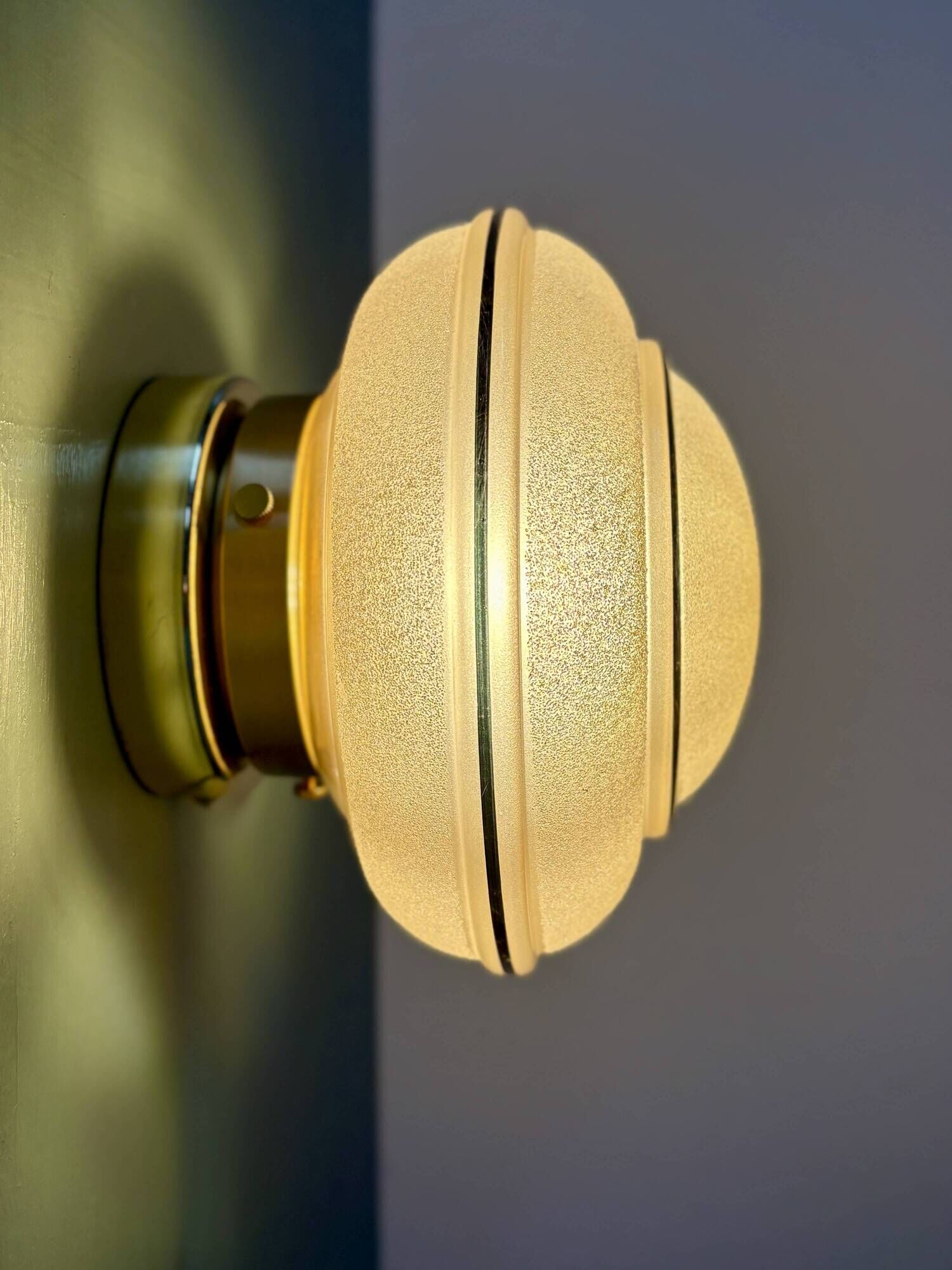 Vintage Art Deco globe wall/ceiling light in frosted yellow and gold glass.