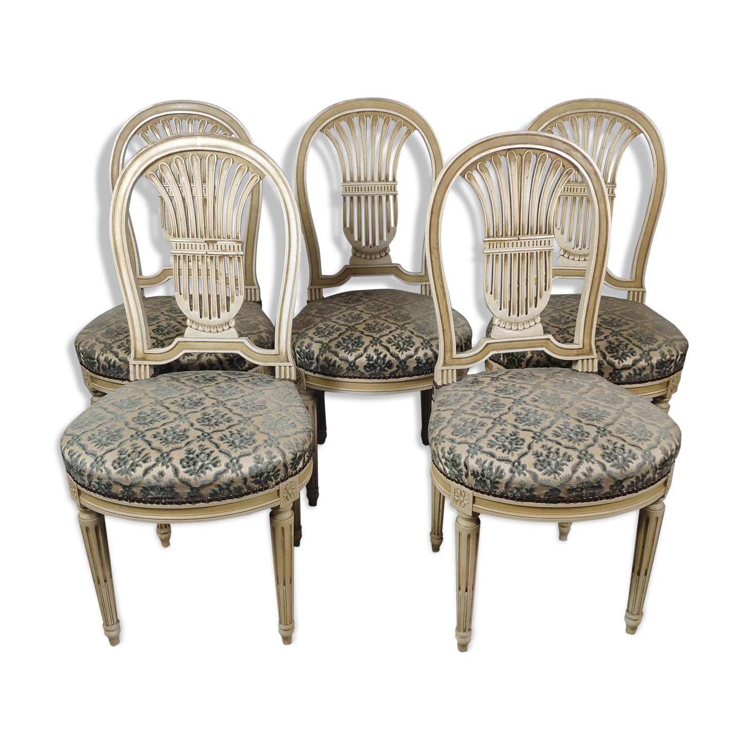 5 chaises en bois laqué blanc style Louis XVI