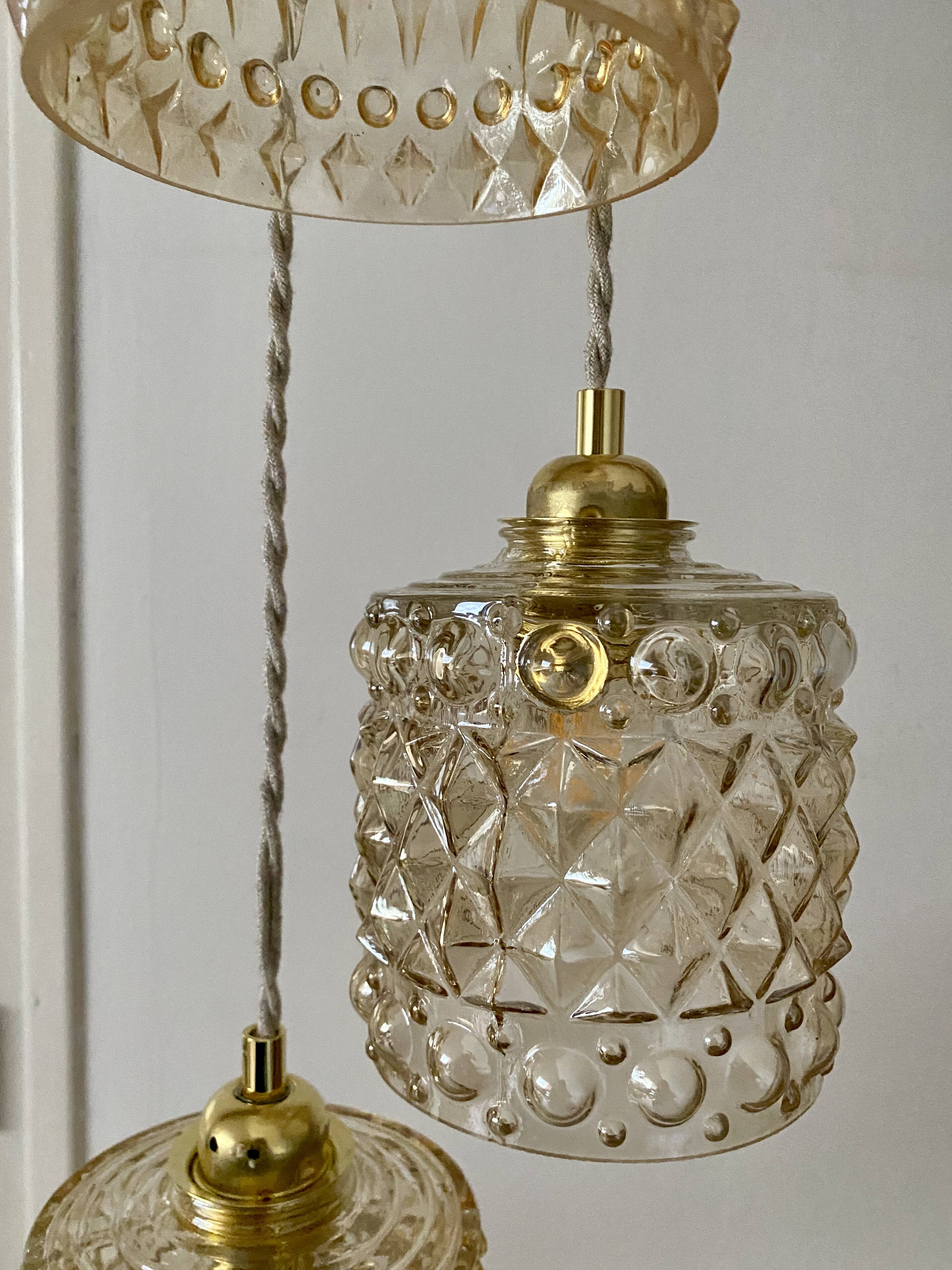 Triple antique globe pendant light in amber glass