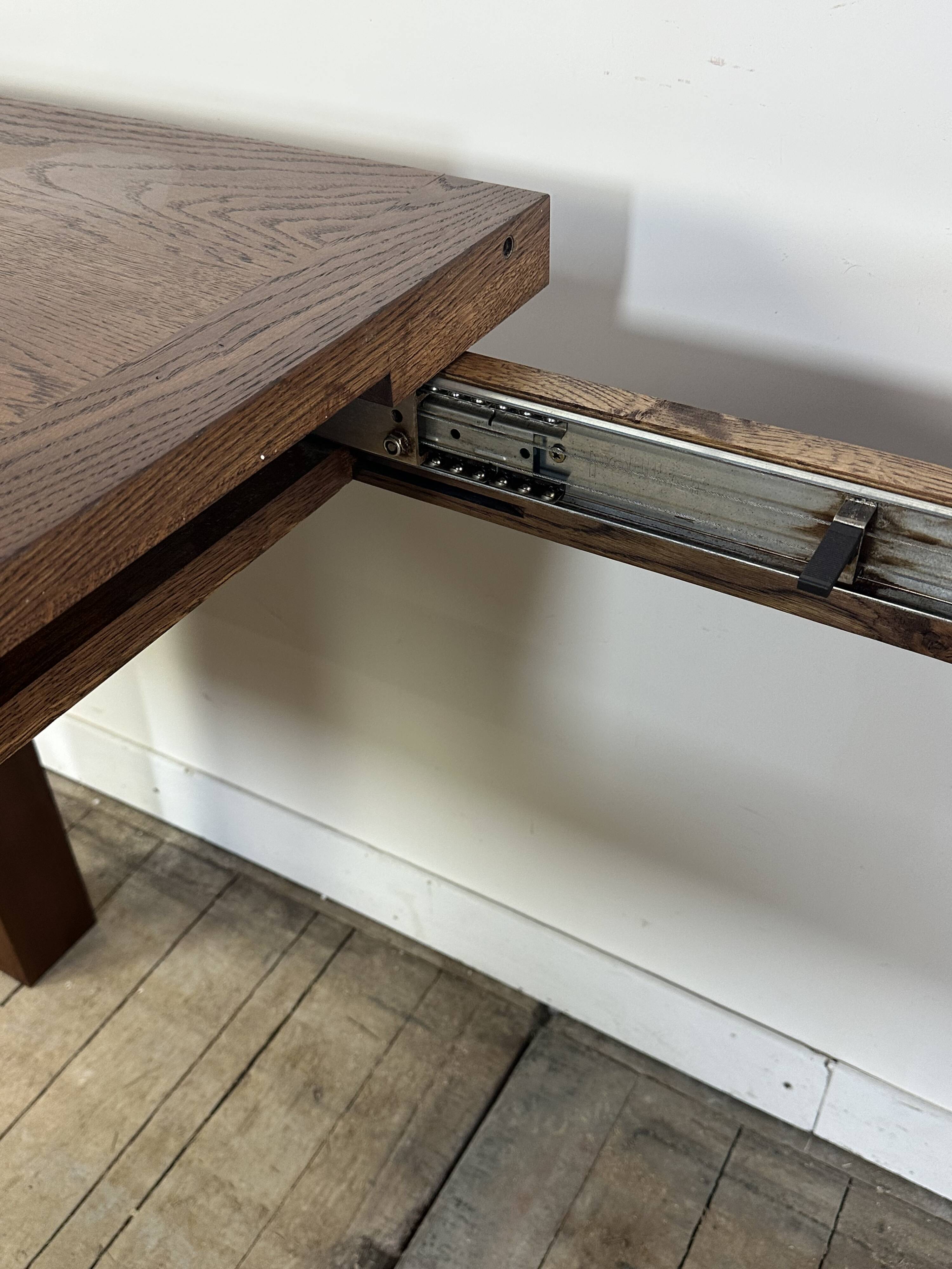 Brutalist solid oak table with 2 extensions from the 1990s.