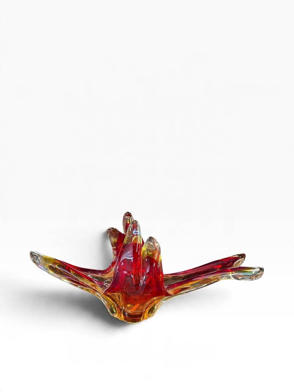 Vintage Murano glass bowl/plate in orange-red with swirling patterns.