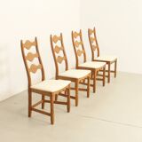 Four oak dining chairs by Henning Kjaernulf.