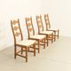 Four oak dining chairs by Henning Kjaernulf.