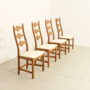 Four oak dining chairs by Henning Kjaernulf.