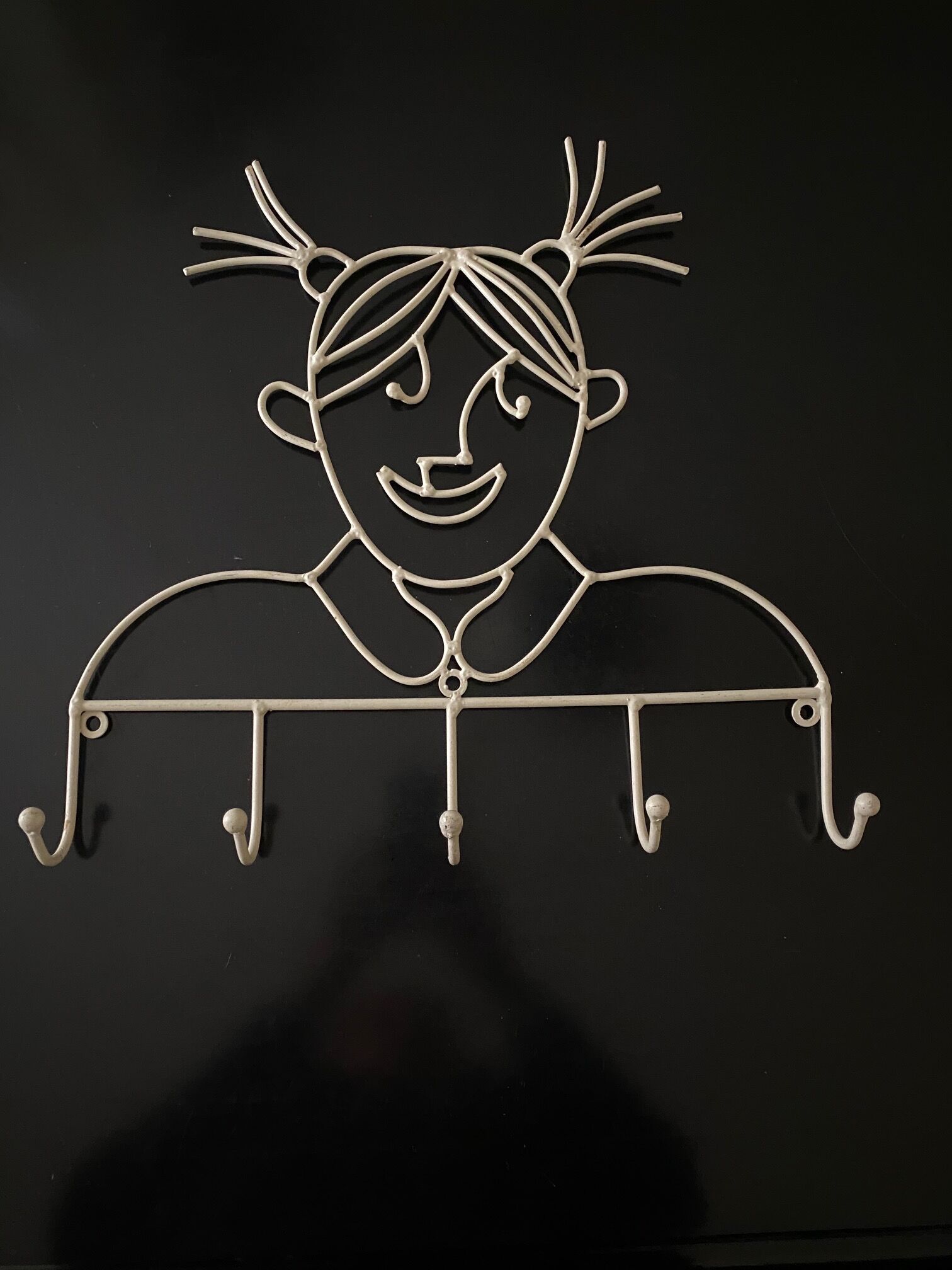 Pair of iron coat holders girl and boy