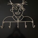 Pair of iron coat holders girl and boy