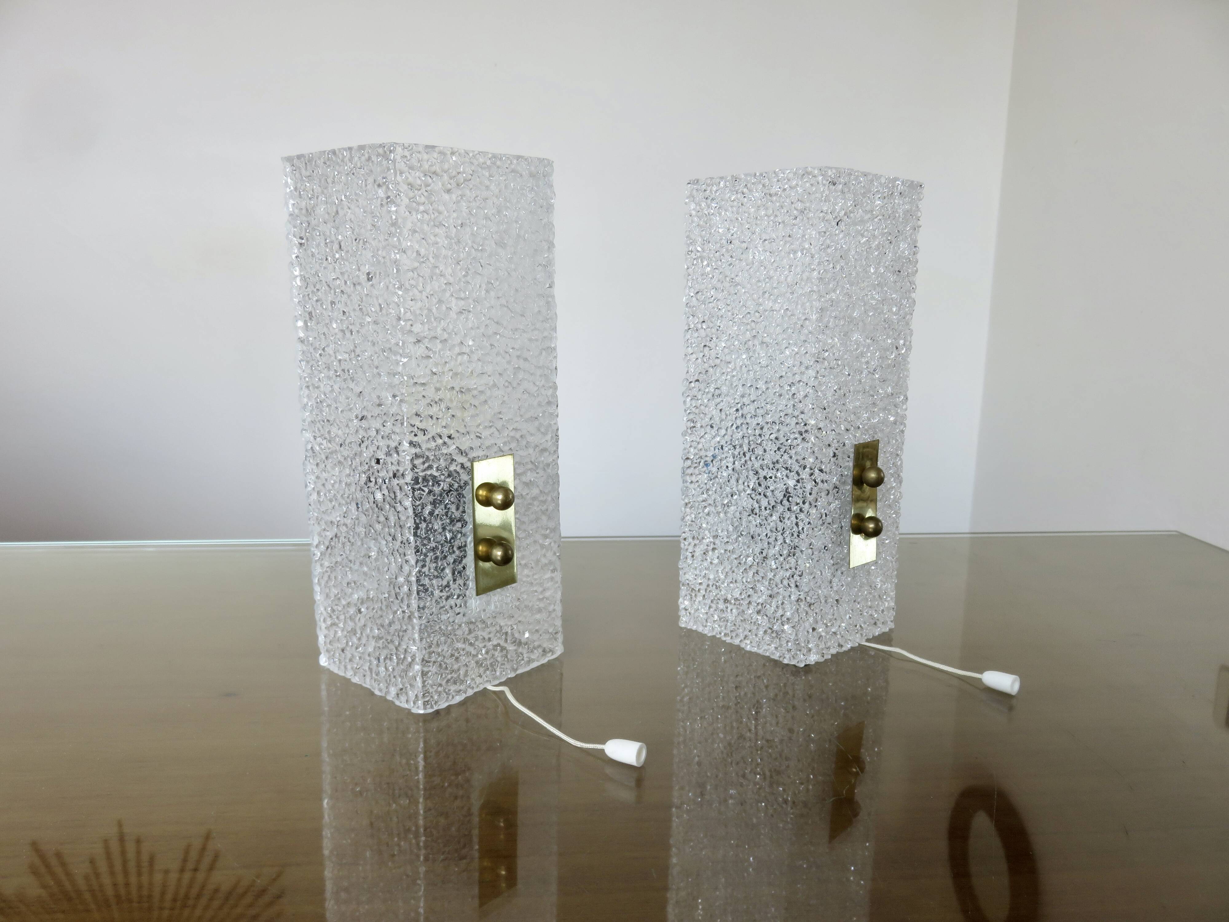 Pair of pull switch wall lights in perspex and gilded brass, France, circa 1960.