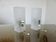 Pair of pull switch wall lights in perspex and gilded brass, France, circa 1960.