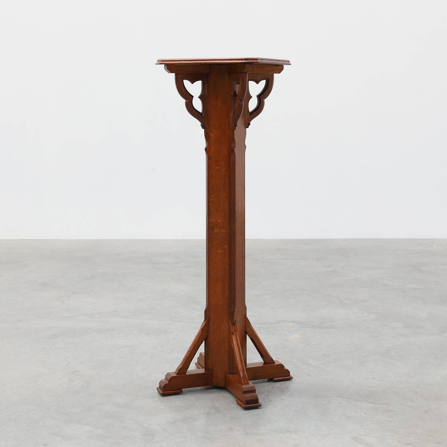 Art Deco oak pedestal with pierced brackets and cross base, Belgium 1920s