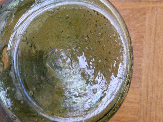 Biot stamped blown glass bottle